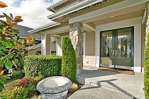 Dramatic entry with beautiful landscaping