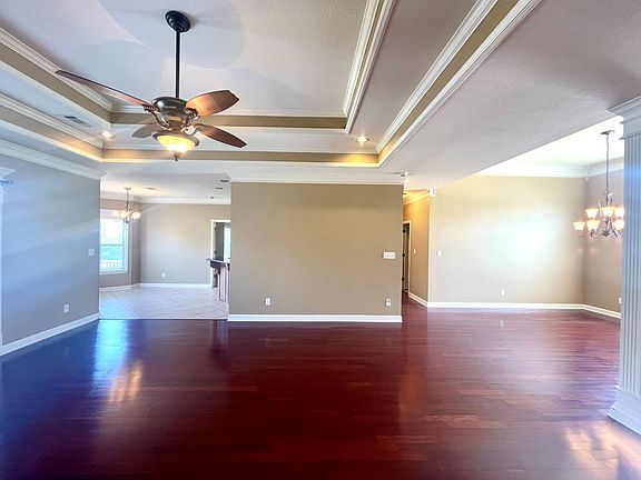 Living Room, looking toward Sunroom (left), Dining Room (R), and Main Hallway