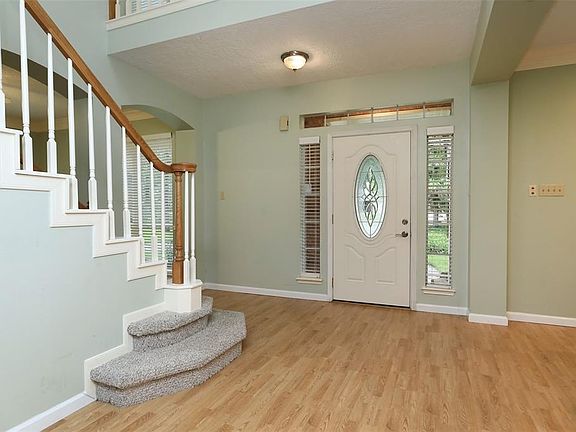 FRONT ENTRY SHOWING SIDE LIGHTS AND TRANSOM