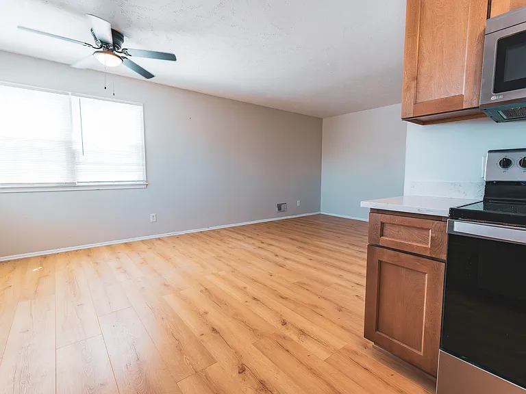 Newly designed kitchen with new cabinets, countertops, sink, hardware, and flooring