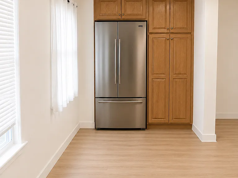 Full size refrigerator and pantry in dining room area.