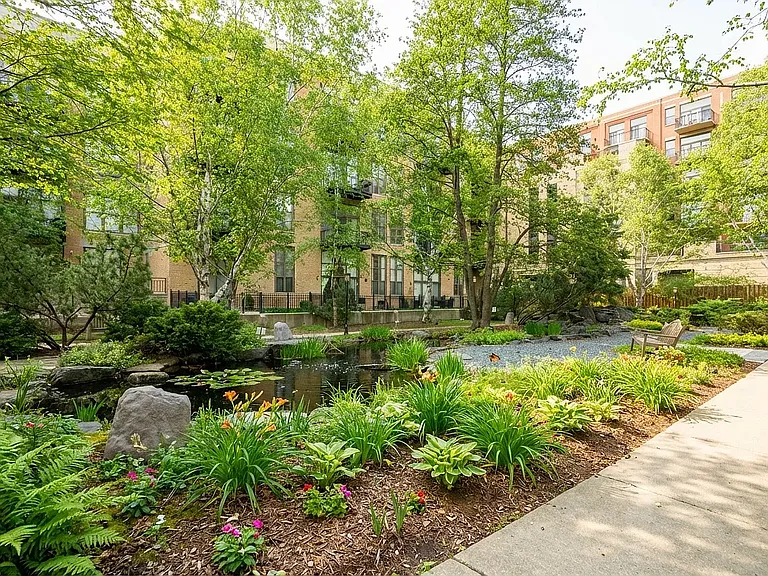 Enjoy the coveted tranquil Block Y courtyard with walking path, benches and serene koi pond