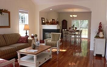 Open and airy living/dining combination. This home is similar to the picture shown.