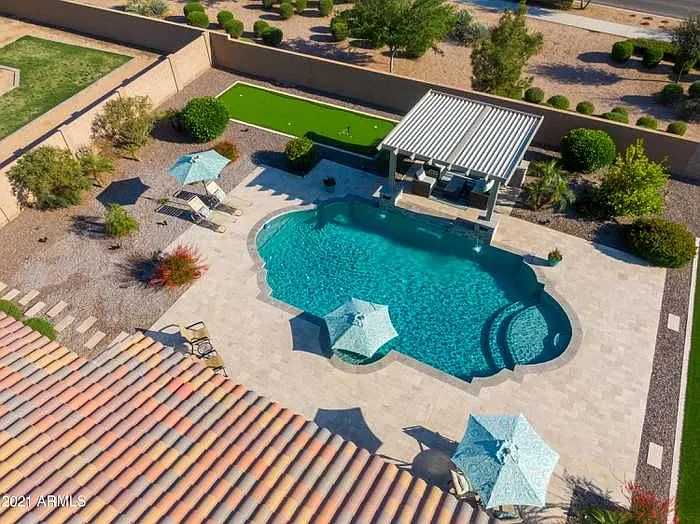 Umbrella can be added the seating area of the 20,000 gallon pool if desired. Gazebo also has a gas fireplace, ceiling fan and furniture