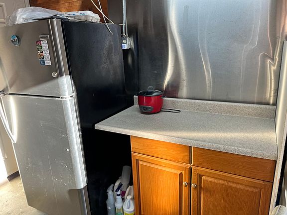 Refrigerator and cooking counter. You can have portable stove/cooking top