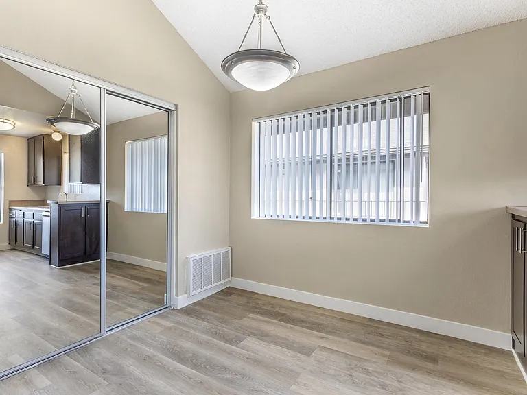 Reflecting modern comfort and style: where the dining room mirror echoes the elegance of our updated kitchens at Independence Plaza.