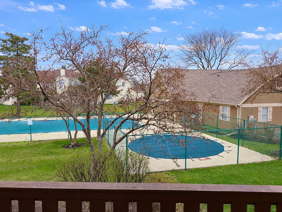 Balcony view overlooking pool and clubhouse