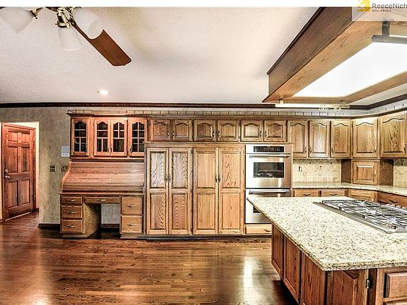 Two pantries offer TONS of additional storage as well as a built-in desk area with glass cabinets.