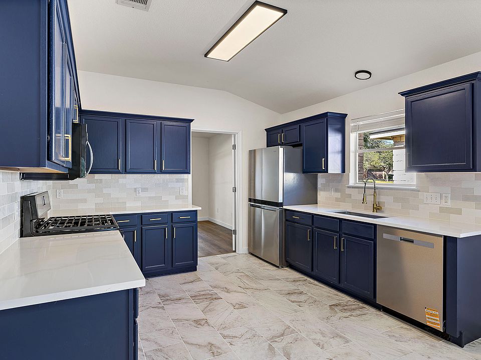 Remodeled Chef's kitchen with new stainless steel appliances, quartz countertops and modern backsplash