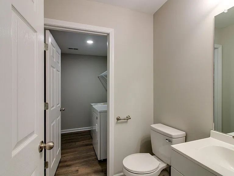 1/2Bath on Main Level with view of Large Laundry Room Washer and Dryer stays at Condo