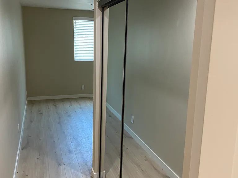 Sliding Mirrored Closet Doors Bedroom Hallway view
