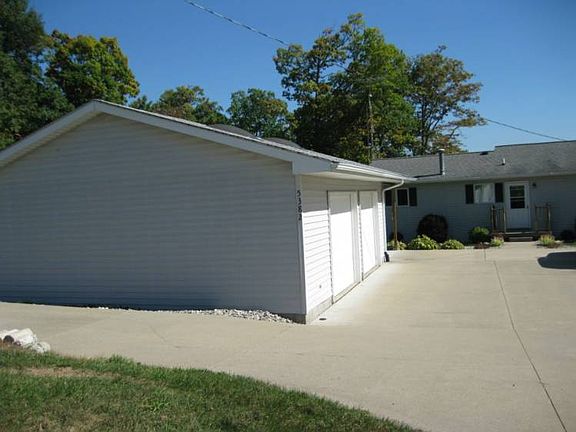 2 car garage and areas for 2 additional cars, or boats. Lots of concrete for parking.