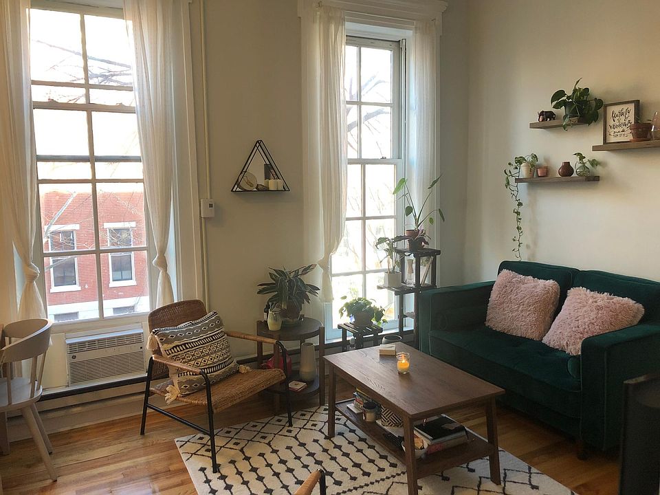 Living room featuring floor-to-ceiling windows