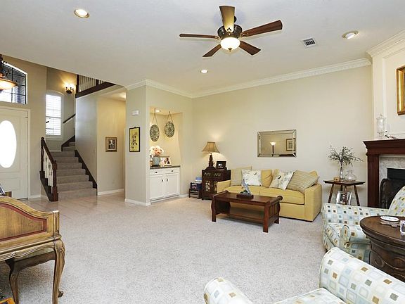 The double doors invite you into the entry, leading to the large living area with gas & woodburning 