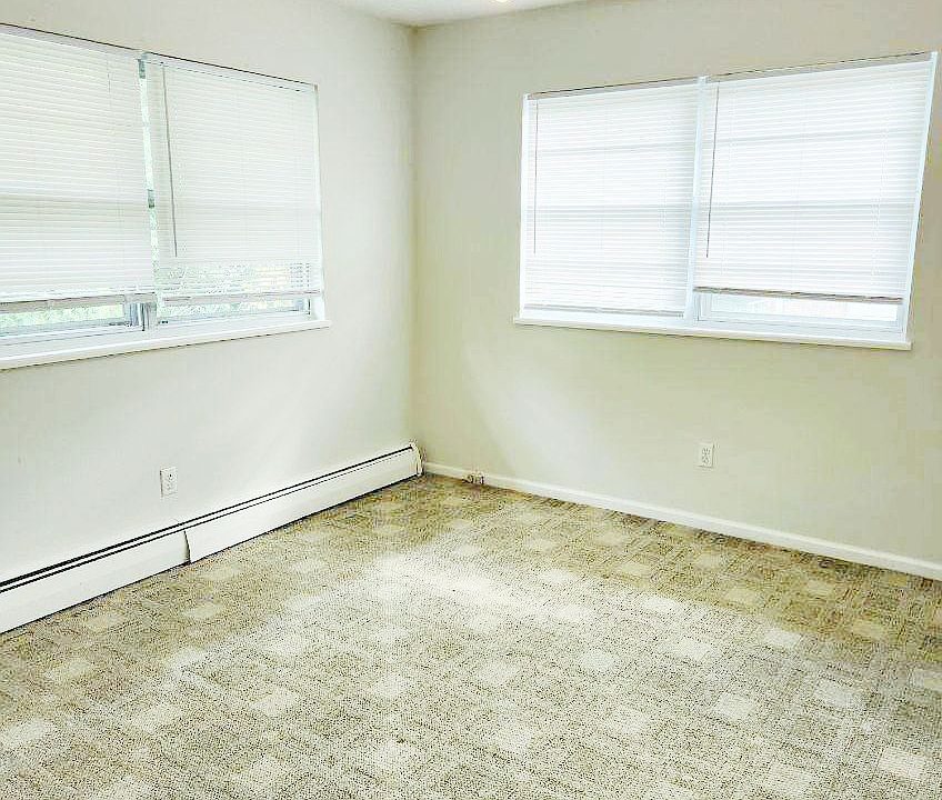 Bedroom 1 with double windows and ceiling fan