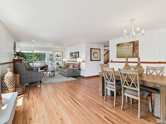 Newly refinished hardwoods greet you as you enter the open concept living space.  