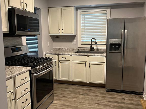 Kitchen space is just off the dining room and the back patio