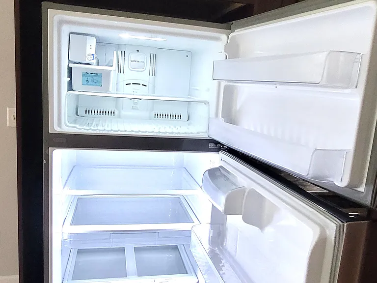 LG Refrigerator with top load freezer.