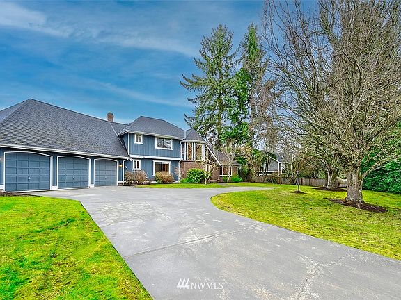 A Long Driveway, Lush Landscaping, And Stylish Curb Appeal Welcomes You Upon Arrival To The Home. Composition Roof Is Only 10 Years Old.