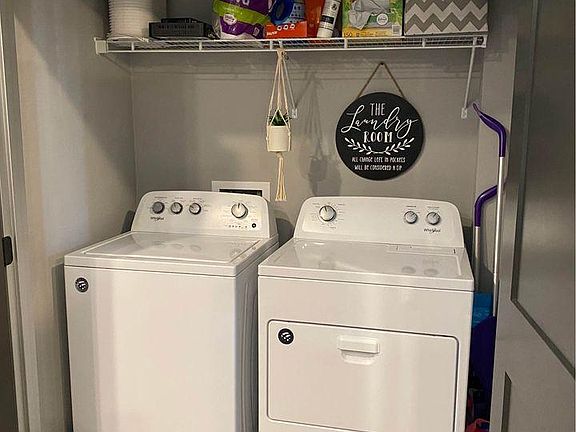 Washer/Dryer with storage above.