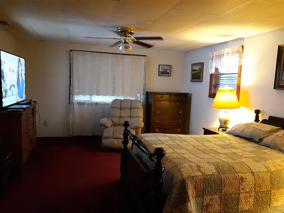 Largest bedroom has two dressers, two closets and large TV.