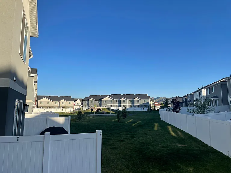 Backyard has tunnels for kids, large sandbox with tire swing and large grassy area
