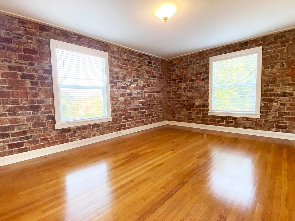 Exposed Brick Walls, Energy Efficient Insulated Windows (Living Room).