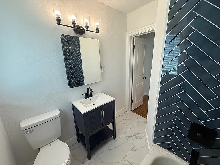 Secondary bathroom with medicine cabinets