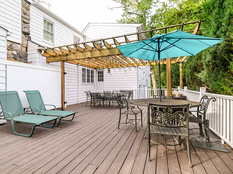 Oversize deck split with shade and sun, and enclosed outdoor hot and cold shower.