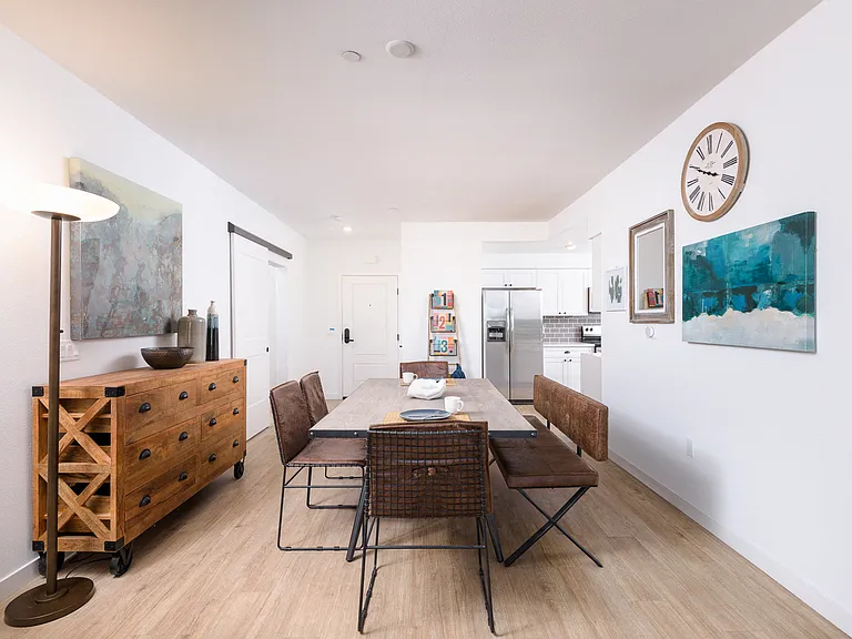 Wood plank-style flooring in living room, kitchen, and bathrooms
