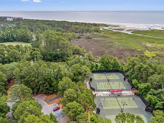 Six Lit Tennis Court in the Adjacent Park System