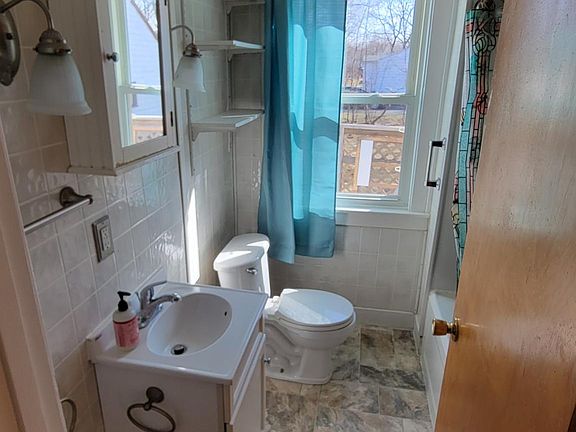 1 bathroom with tub shower combo