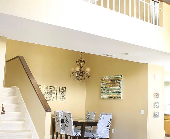 Home entryway overlooking the dining area. High ceiling with couple Sky lights