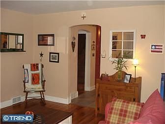 Living room with kitchen entry