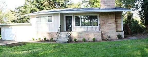 Tastefully updated with new roof, fresh exterior paint and vinyl windows!