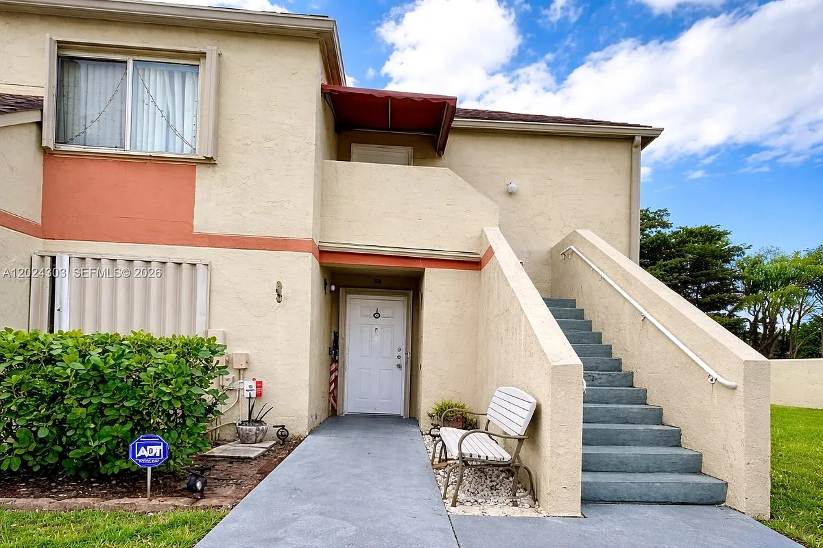 Building Photo - 18810 NW 57th Ave #102