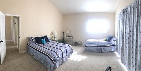 Upstairs bedroom with large closets and deck.