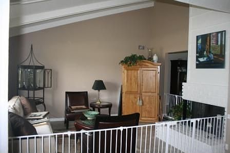 Vaulted ceilings and fireplace create a nice formal living room.