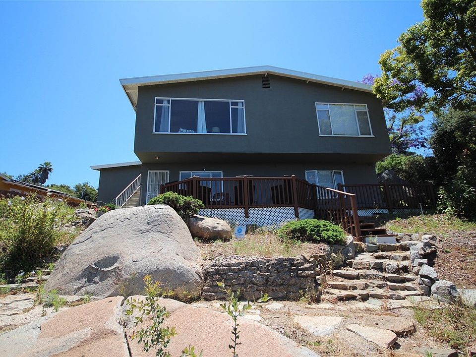 Backyard laced with boulders faces Cowles Mountain and most of East County
