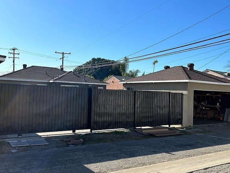Back Yard outside iron door View with Garage unit