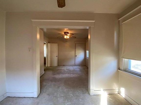 This bedroom has a captive nursery, office, or workout room. Will be all refinished hardwood floors