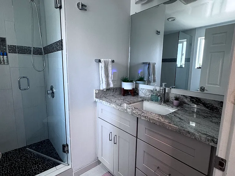 This bathroom is located just off the living room.