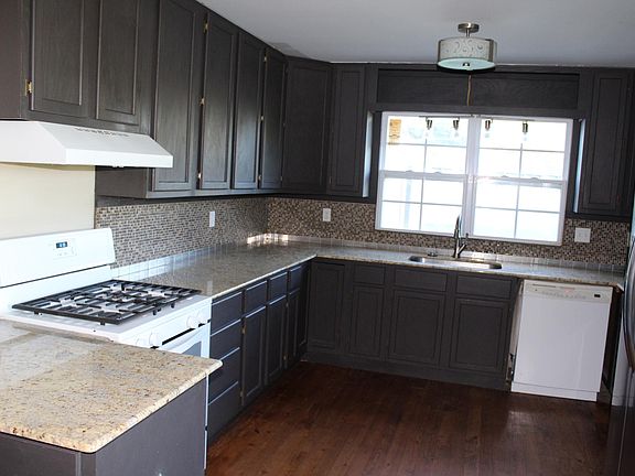Updated kitchen with beautiful counter tops and real hardwood floor