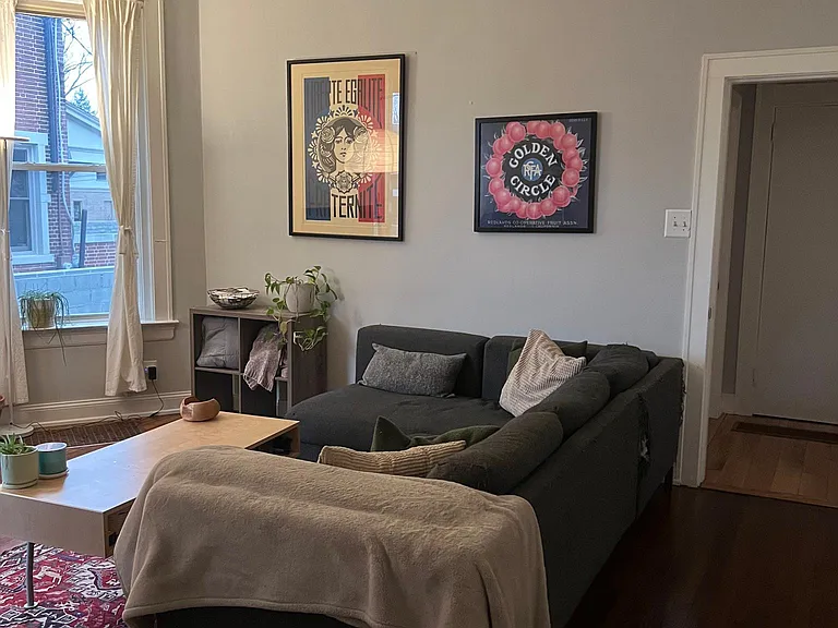 Living room with 12 foot ceilings and refinishing original hardwood floors