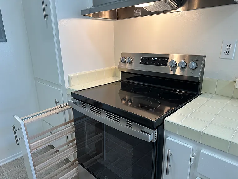 Stainless Steel Range and Hood with Spice Rack Drawer