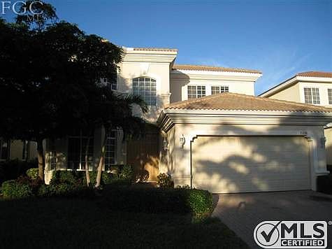 Quality everywhere with CBS construction, tile roof, paver driveway and lush landscaping.