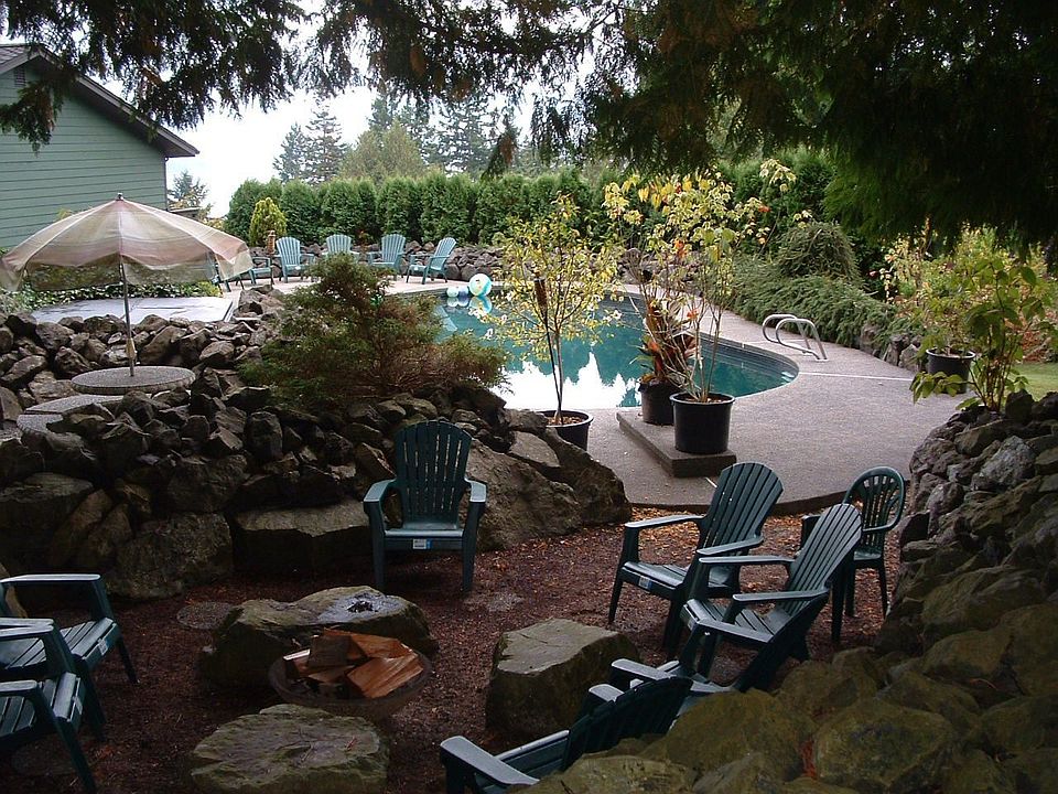 refreshing and stunning black gunite pool