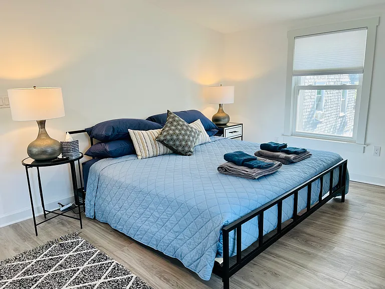 Spacious Primary Bedroom with 
King size bed, full closet, dresser, two end tables and smart tv.