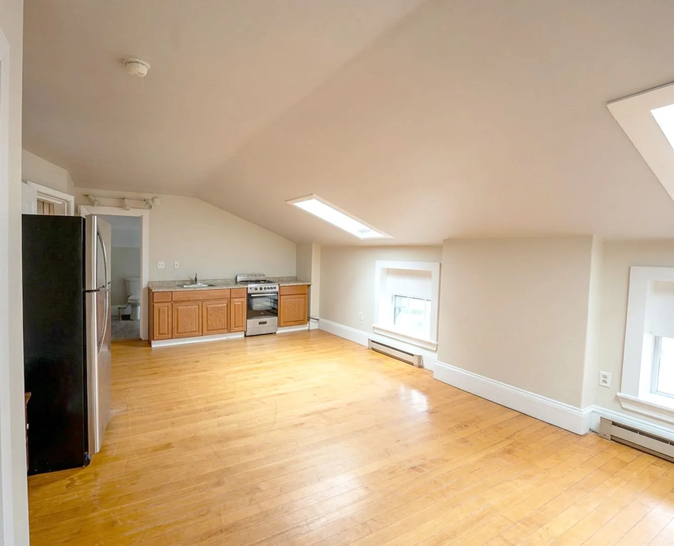 Top-Floor 2-Bedroom Oasis | Heat, Hot Water, Parking & Laundry in the West End! — Photo 2