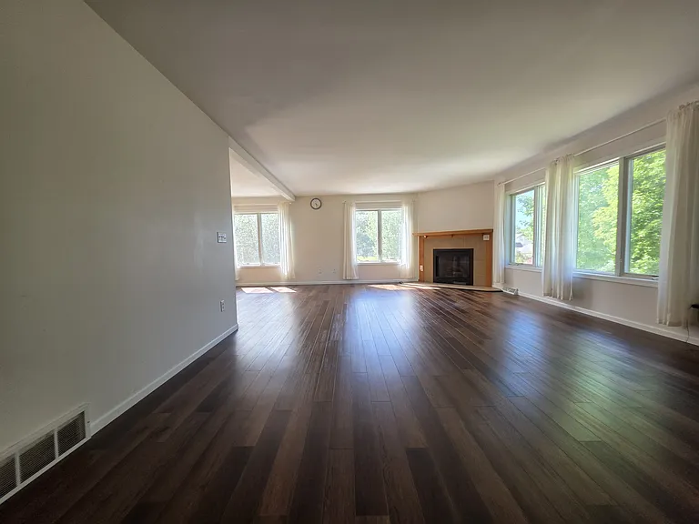 living room connected to dining area and kitchen
